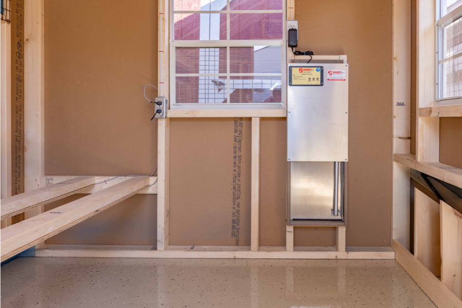 smart chicken door inside coop by roosting bars